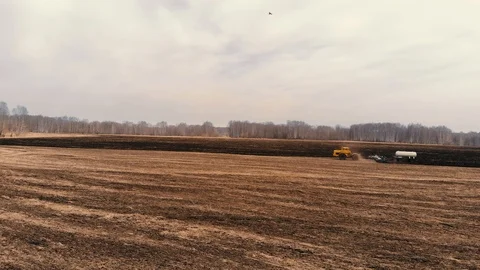 Tractor trailer fertilizes the ground Stock Footage 93547899