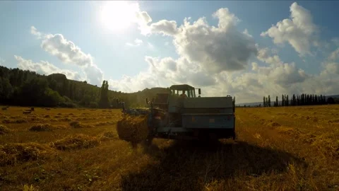 Tractor With Trailer Making Hay Bales Stock-Footage 140281134