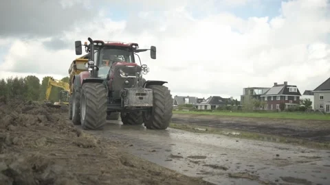 Tractor With Trailer at Muddy Construction Site in The Netherlands Vídeos de archivo 346882358