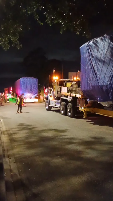 A tractor-trailer is transporting a train car in Bogotá Stock Footage 316834794