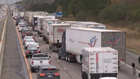 Tractor trailer trucks stuck in epic highway traffic jam and gridlock Stock Footage