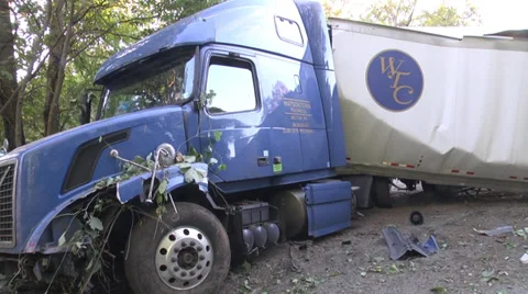 Tractor trailer wrecked pan of full rig at scene MS Stock Footage
