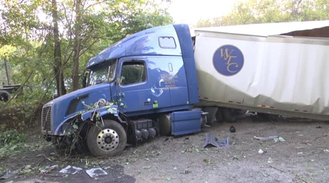 Tractor trailer wrecked pan of full rig at scene WS Stock Footage
