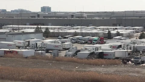 Tractor trailers sit parked during COVID 19 lockdown and economic recession Stock Footage 151664441