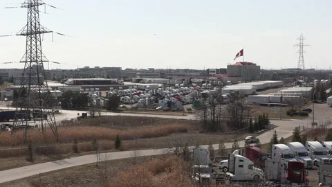 Tractor trailers sit parked during COVID 19 lockdown and economic recession Stock Footage 151664936