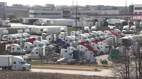 Tractor trailers sit parked during COVID 19 lockdown and economic recession Stockbeeldmateriaal 151664994