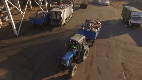 Tractor Transporting Garbage in Trailer at Waste Sorting Facility, Aerial View Vidéo 334649550