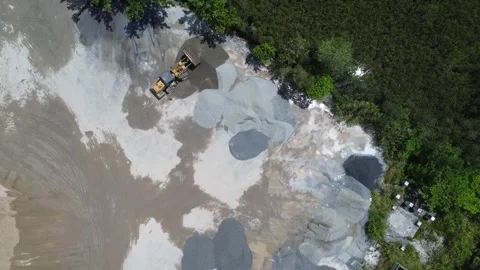Tractor transporting raw materials for cement production into a grinding ma.. Stock Footage 327996443