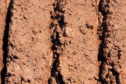 Tractor Tread Marks On Dried Mud Stock Photos