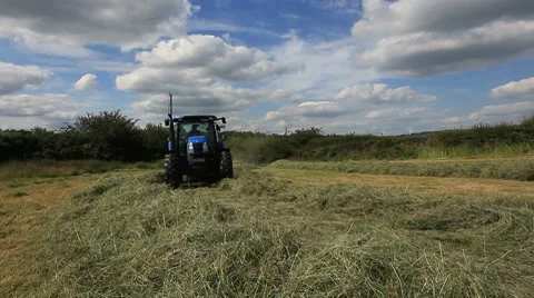 Tractor turning hay Stock Footage 7903722