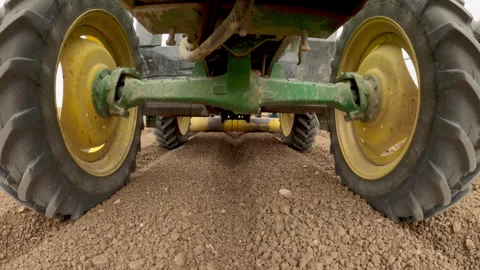 Tractor Underneath Shot as It Plants Seeds Field Stock Footage 313361000