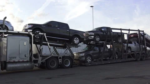 A tractor unit with a car carrier trailer transporting passenger vehicles Stock Footage 61180094