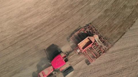 Tractor with a unit that processes dusty, arid soil Stock Footage 156205048