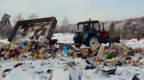 Tractor Unloading Garbage on Dumping Ground Near the Forest Stock Footage 65441121