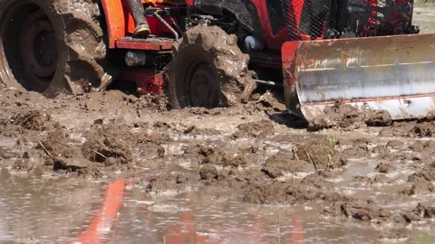 The tractor was working to beat the soil and mix it with water to grow the grain Stock Footage 146721148