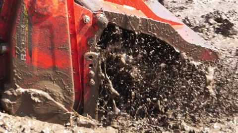 The tractor was working to beat the soil and mix it with water to grow the grain Stock Footage 146721606