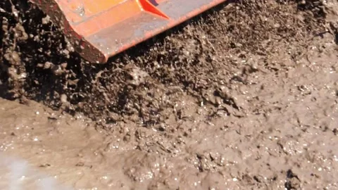 The tractor was working to beat the soil and mix it with water to grow the grain Stock-Footage 146721849