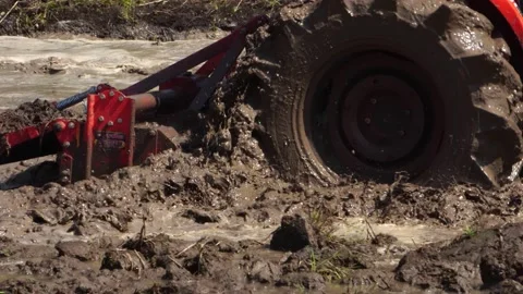 The tractor was working to beat the soil and mix it with water to grow the grain Stock Footage 152716754