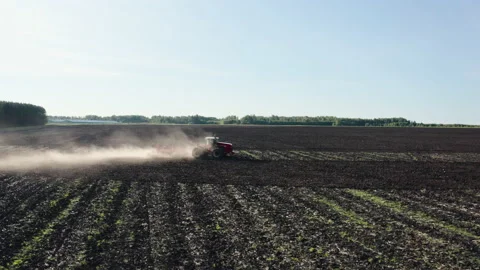 The tractor is watering the wheat field Stock Footage 159954318