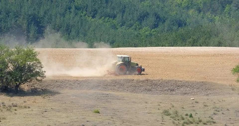 Tractor  in wheat field Stock Footage 121083685