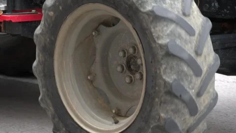 Tractor wheel rotating on asphalt road Stock-Footage 314570577