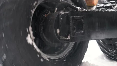 Tractor wheel slips in the snow close up Stock Footage 169549090