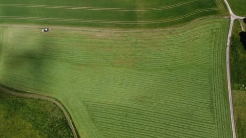 Tractor while harvesting fodder, drone shot. 스톡 동영상 139315008