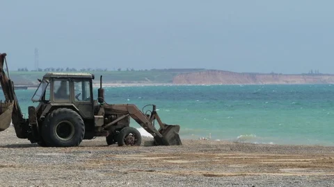 Tractor Working On The Beach Stock Footage 75439232