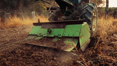 Tractor Working The Dirt Soil And Creating Dust Stock Footage 316691400