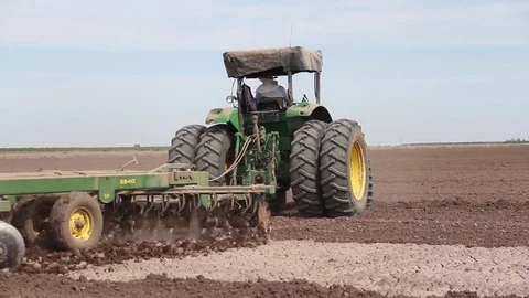 Tractor working a field 2 Stock Footage 82590000