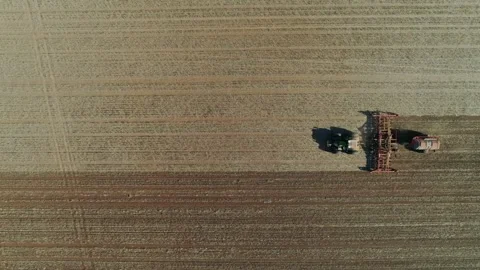 Tractor working in a field 4k Stock Footage 311690990