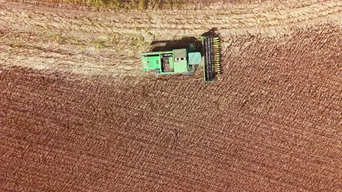 Tractor working in a field during planting season Stock Footage 345427835