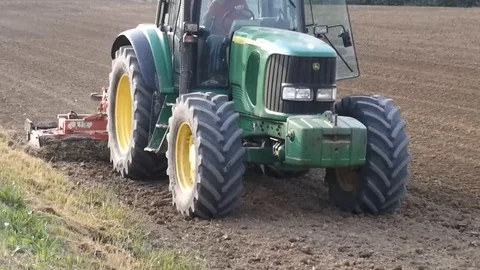 Tractor working in a field Video stock 90014526