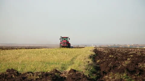 Tractor is working in the field Stock Footage 140195802
