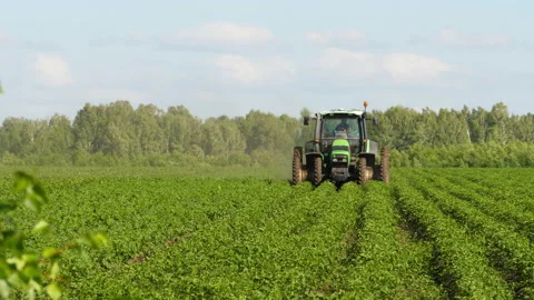 Tractor working in the field Stock Footage 201031154