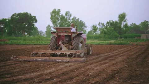Tractor working in field Stock Footage 249765724