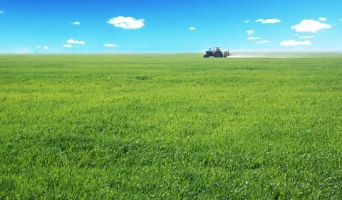 Tractor working in a field Stock Photos