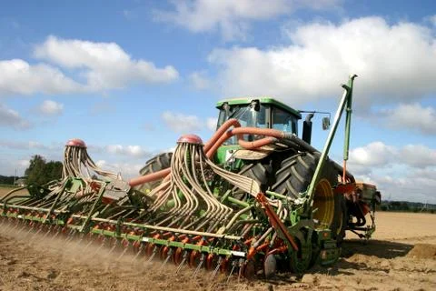 Tractor working on the field Stock Photos