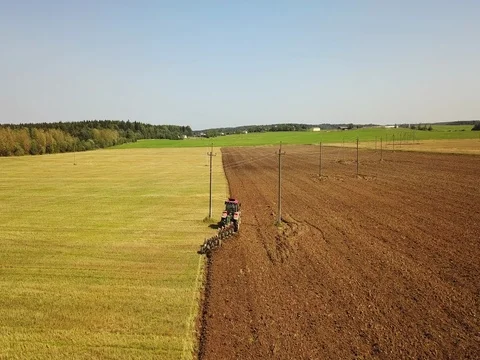 Tractor working in the field plowing soil. Stock Footage 80084187