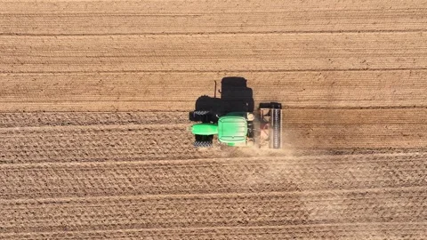 Tractor working the field for soil cultivation and crop preparation Stock Footage 336567646