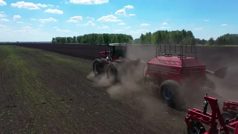 Tractor working in the field, sows grain Stock Footage 130522160