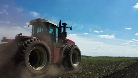 Tractor working in the field, sows grain Stock Footage 130522168