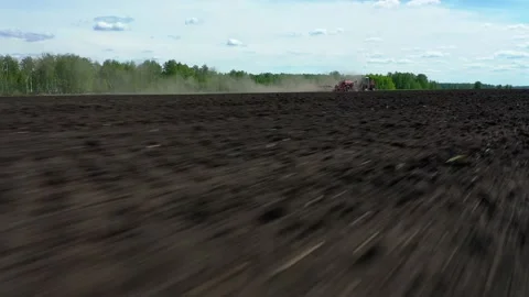 Tractor working in the field, sows grain Stock Footage 130522413