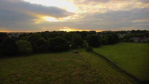Tractor working the field at sunset Stock Footage 278183839