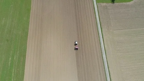 Tractor working in the fields aerial shot Stock Footage 84760752