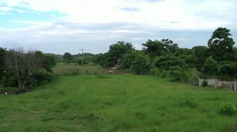 Tractor working in the fields in ecuador Stock Footage 10860232