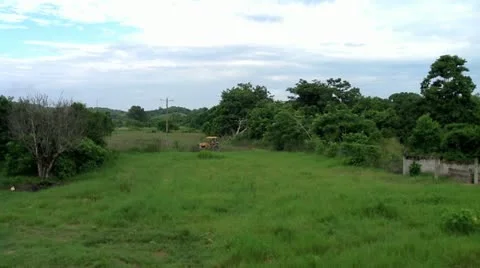 Tractor working in the fields in ecuador Stock Footage 10860252