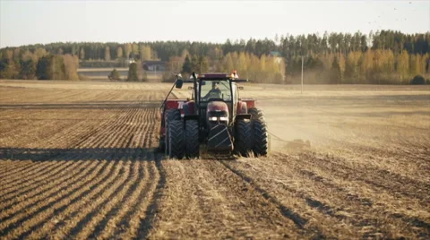 Tractor working in the grain fields in slow motion 動画素材 40243273