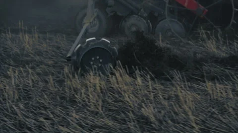 Tractor working in the grain fields - tight shot of the wheels 動画素材 40243158