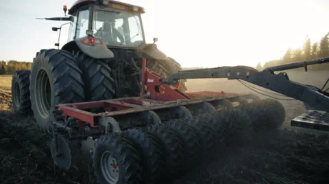 Tractor working in the grain fields - wide shot, slow motion 動画素材 40243119